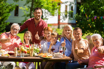 happy family having dinner or summer garden party
