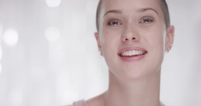 Young attractive woman waits for the directors instruction in front of a white background