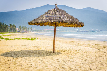 Straw umbrella in the beach