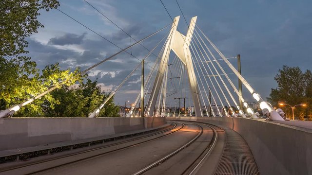 Krakow, Poland, traffic on bridge, tramway time lapse video in the evening