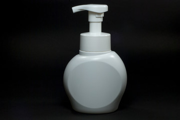 White cosmetic package with black background