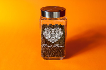 Coffee jar on orange background