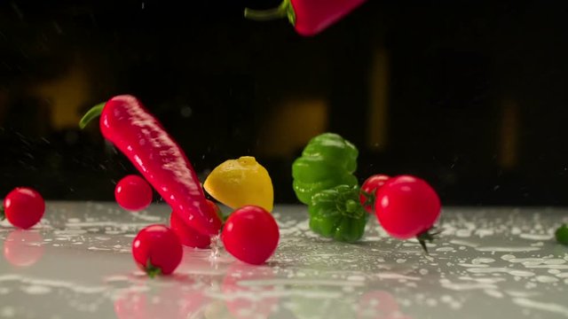 Mixed vegetable falls over kitchen table. high spped camera. super slow