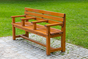 Interestin unusual wooden park bench at a park