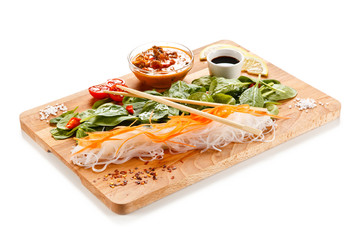 Rice noodles with meat, sauce and vegetables