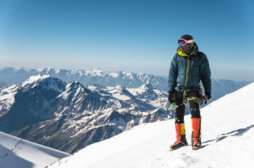 Fototapeta na wymiar Professional guide - climber on the snow-covered summit of Elbrus sleeping volcano