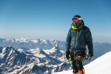 Fototapeta na wymiar Professional guide - climber on the snow-covered summit of Elbrus sleeping volcano