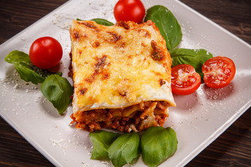 Lasagna on wooden background