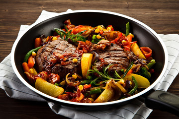 Grilled steaks and vegetables