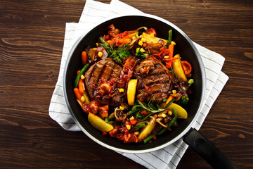 Grilled steaks and vegetables