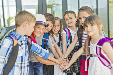 Portrait Of School Pupils Outside Classroom Carrying Bags