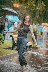 A young woman to have fun in the rain