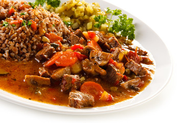 Roasted meat, groats and vegetables
