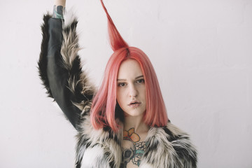 Cool young woman with pink hair