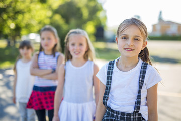 Fototapeta premium cheerful school age child play on playground school