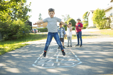 cheerful school age child play on playground school