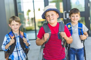 Boy Standing Outside School With Rucksack