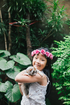 Girl portrait with slow loris in the zoo