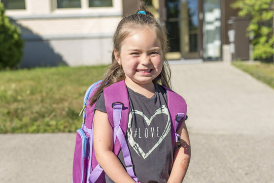 pre-school student going to school with smile
