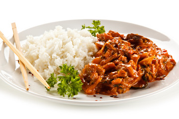 Rice dish with sauce on white background