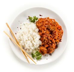 Rice dish with sauce on white background