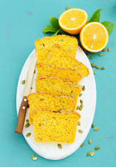 Homemade pumpkin bread with seeds and orange peel.