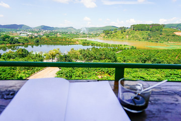 Beautiful view with cup coffee and a book