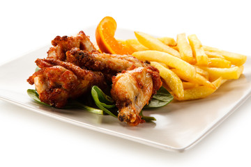 Grilled chicken wings and vegetables