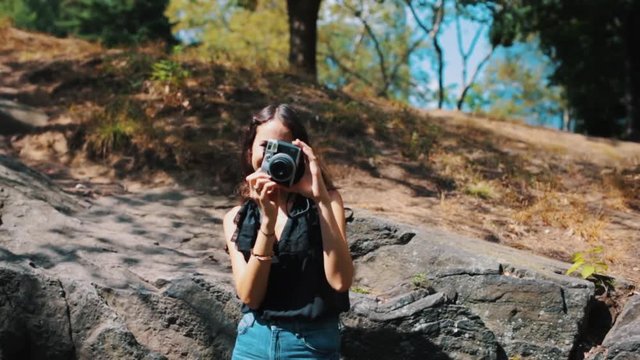 Young Beautiful Female Student Taking Pictures in Central Park New York City