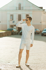Fototapeta premium Young handsome man in white wear