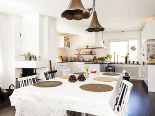 fancy interior with kitchen table with kitchen unfocused in the background