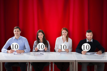 Panel Judges Holding 10 Score Signs