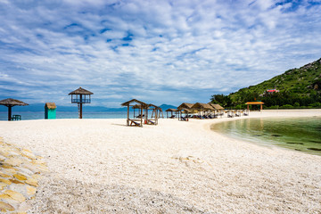 Lounge chairs under tent on the beach