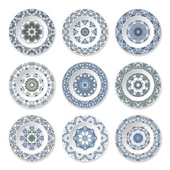 Set of decorative plates with a circular blue pattern, top view. White background. Vector illustration.