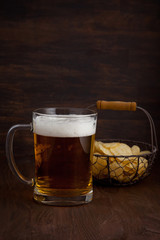 Glass of cold beer with appetizers