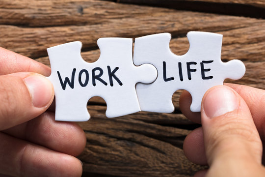 Hands Holding Work Life Matching Jigsaw Pieces