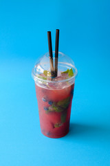 watermelon and blueberry drink on blue background