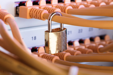 Padlock Attached To Network Cable In Server Room