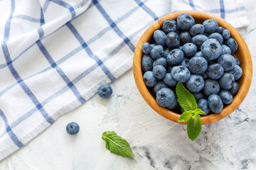 Wooden bowl with blueberries.