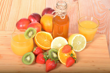 Orange juice in a glass and apple in a bottle