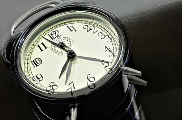 30 Minutes  / close up of   two, overlapping images with  retro alarm clocks, showing different...