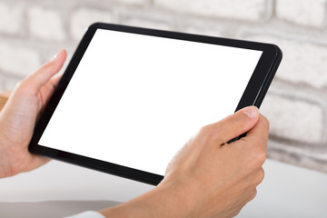 Close-up Of A Person Using Digital Tablet