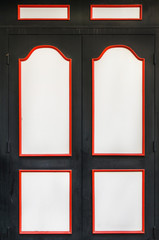 Detail on a black door with white planks