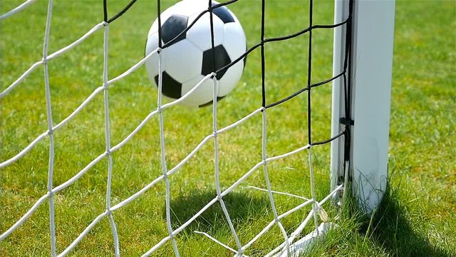 Slow motion of football soccer ball goal into net