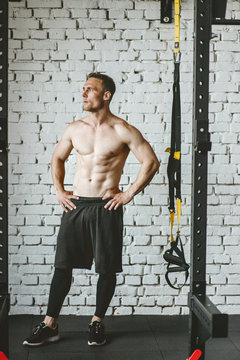 Man in sportswear exercising at gym
