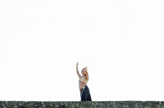 Free woman ancing on sky far away