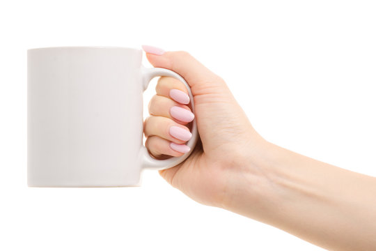 White mug in a woman's hand