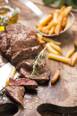 Delicious beef steakes on wood
