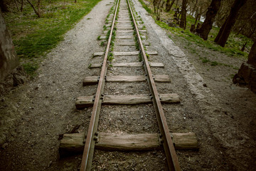 Old abandoned railway track in the forest