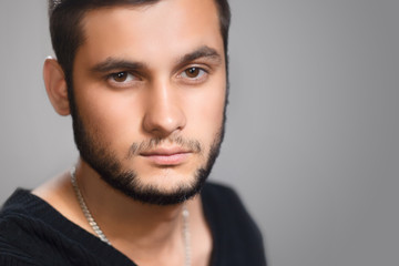 Casual young man studio portrait